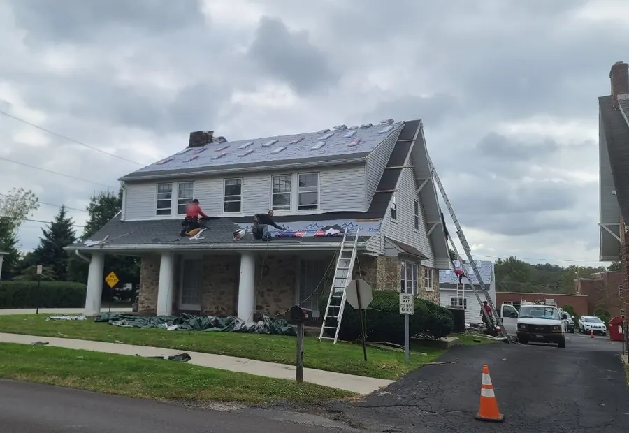 Crew working on a Cape Cod roof