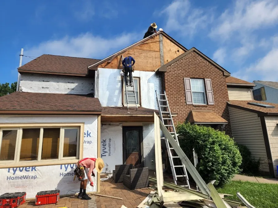 New roof going on, walls wrapped